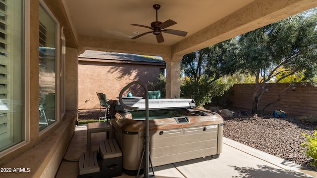 view of patio / terrace featuring a hot tub and ceiling fan