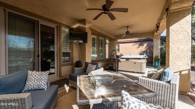 view of patio with ceiling fan and outdoor lounge area