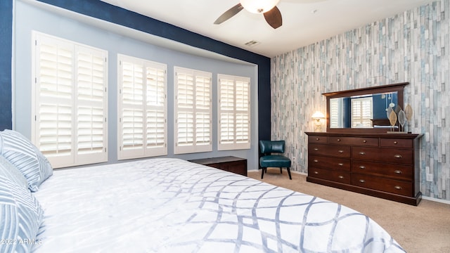 carpeted bedroom with ceiling fan