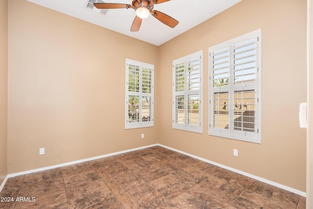 unfurnished room with ceiling fan