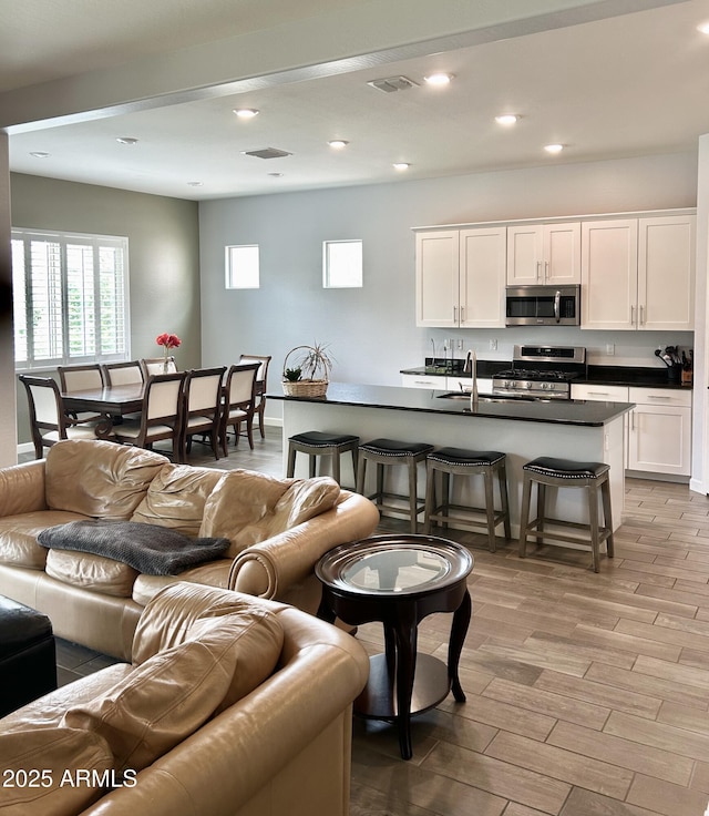 4956 S Leisure Way, Gilbert, AZ 85298 - living area featuring light wood-style flooring and recessed lighting