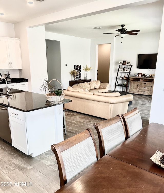 4956 S Leisure Way, Gilbert, AZ 85298 - living room with wood finished floors and a ceiling fan