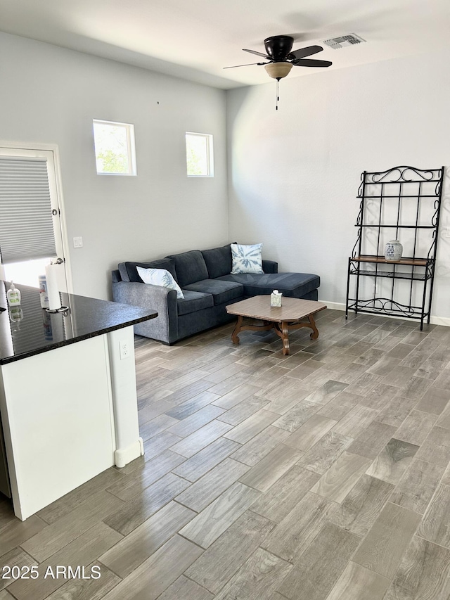 4956 S Leisure Way, Gilbert, AZ 85298 - living room featuring ceiling fan and wood finished floors
