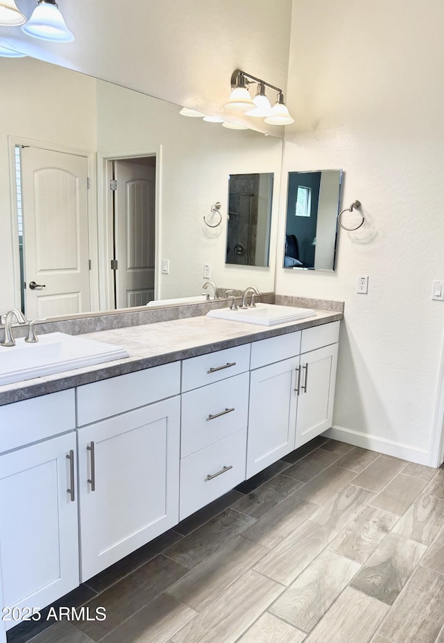 4956 S Leisure Way, Gilbert, AZ 85298 - full bathroom featuring double vanity and baseboards