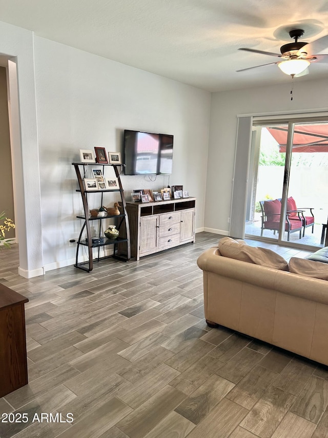 4956 S Leisure Way, Gilbert, AZ 85298 - living area with wood finished floors, ceiling fan, and baseboards