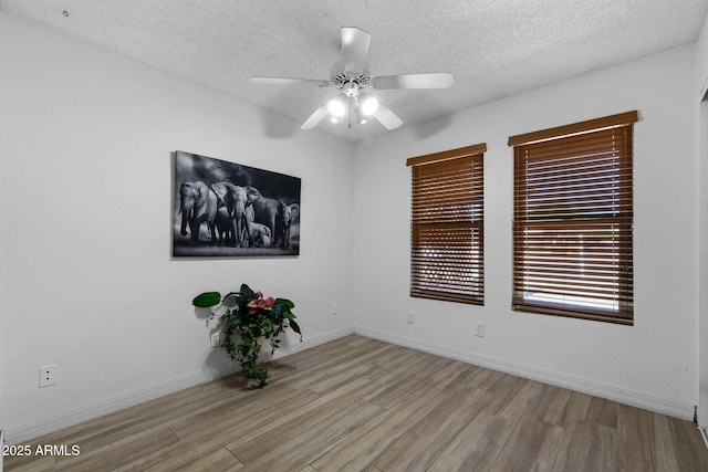 2804 N Nebraska St, Chandler, AZ 85225 - spare room featuring wood finished floors, a ceiling fan, a textured ceiling, and baseboards