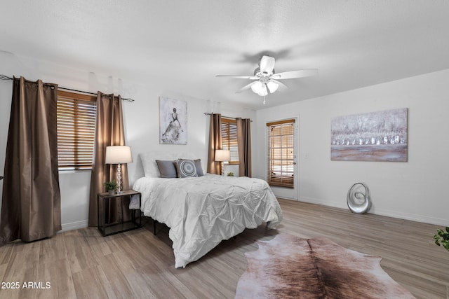 2804 N Nebraska St, Chandler, AZ 85225 - bedroom with wood finished floors, baseboards, a ceiling fan, and access to exterior