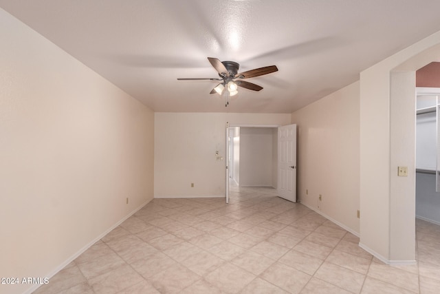 unfurnished room with ceiling fan