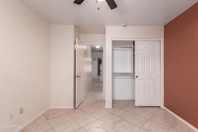 unfurnished bedroom featuring a closet and ceiling fan