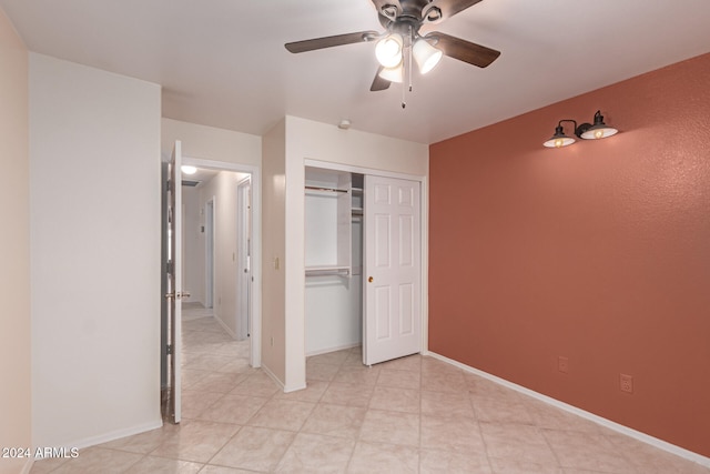 unfurnished bedroom with a closet and ceiling fan