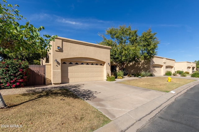 view of front of house featuring a front yard and a garage