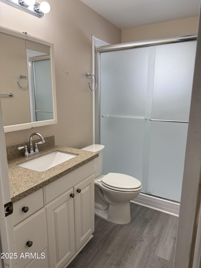 6048 E Des Moines St, Mesa, AZ 85205 - bathroom with wood finished floors, vanity, and a shower stall