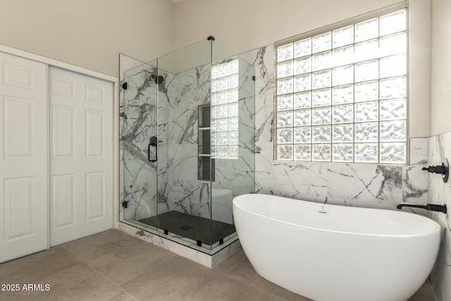 bathroom featuring separate shower and tub