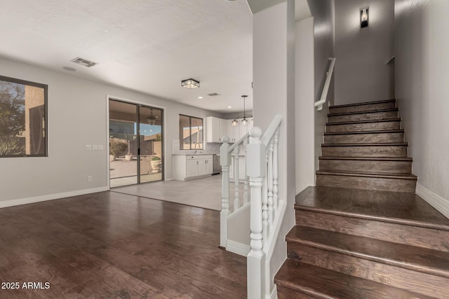 staircase featuring hardwood / wood-style flooring