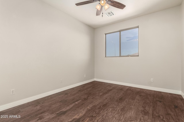 unfurnished room with dark hardwood / wood-style floors and ceiling fan