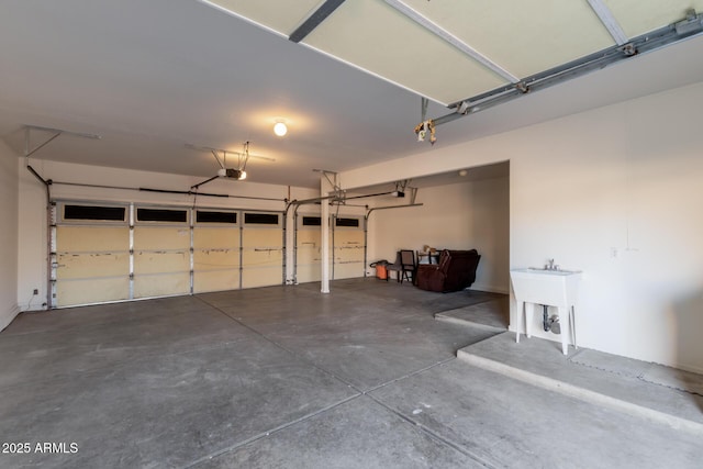 garage with sink and a garage door opener