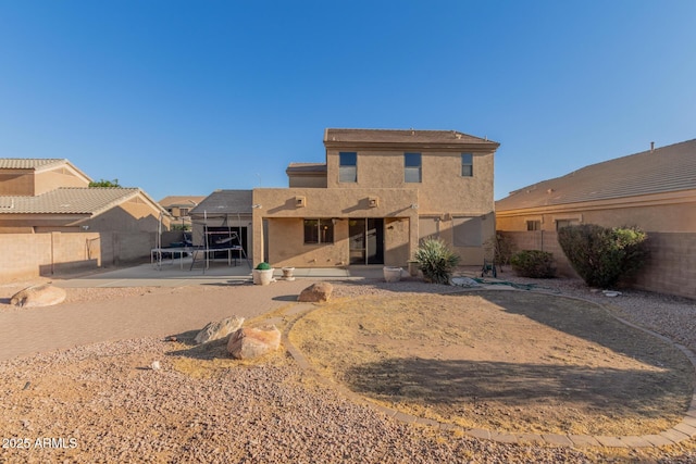 back of property featuring a patio area