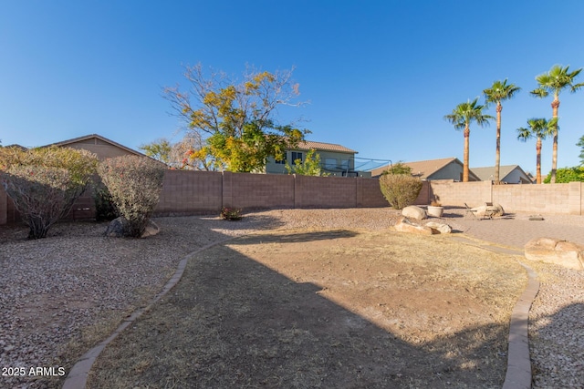 view of yard with a fenced backyard