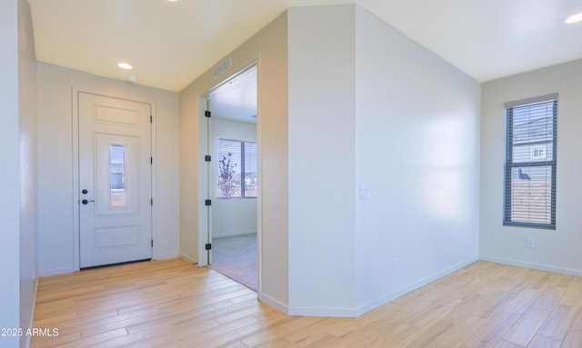 foyer entrance with visible vents, recessed lighting, baseboards, and light wood-type flooring