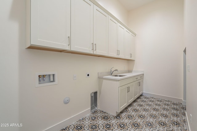 laundry area featuring cabinets, hookup for a washing machine, sink, and hookup for an electric dryer