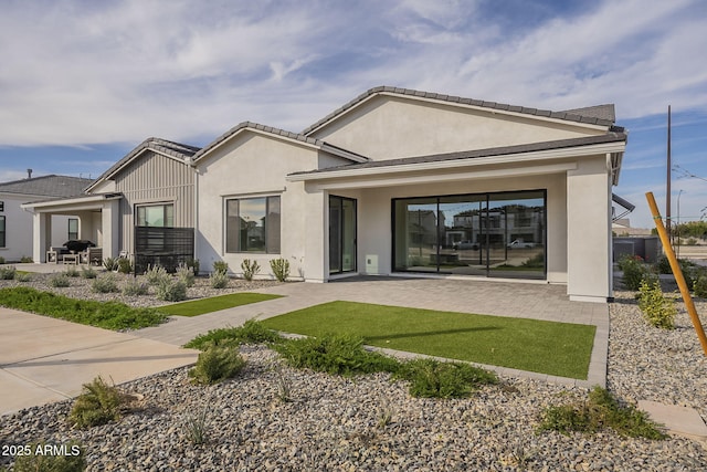 back of house with a patio area