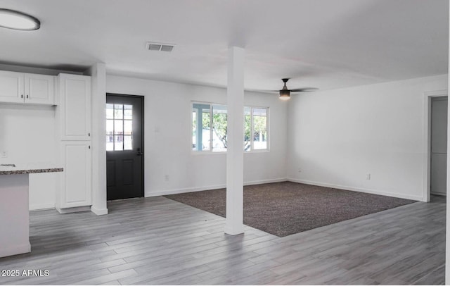 foyer entrance featuring ceiling fan and light hardwood / wood-style flooring