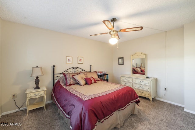 carpeted bedroom with a textured ceiling and ceiling fan