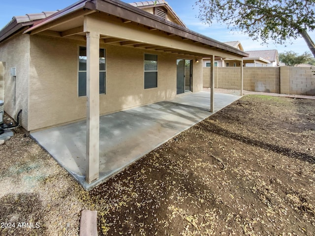 rear view of property featuring a patio