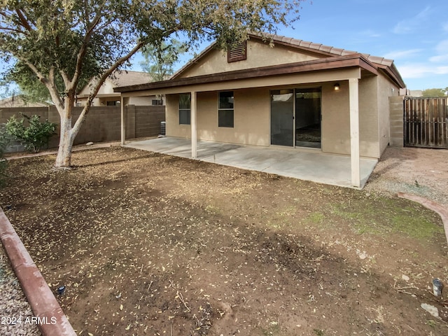 back of property featuring a patio