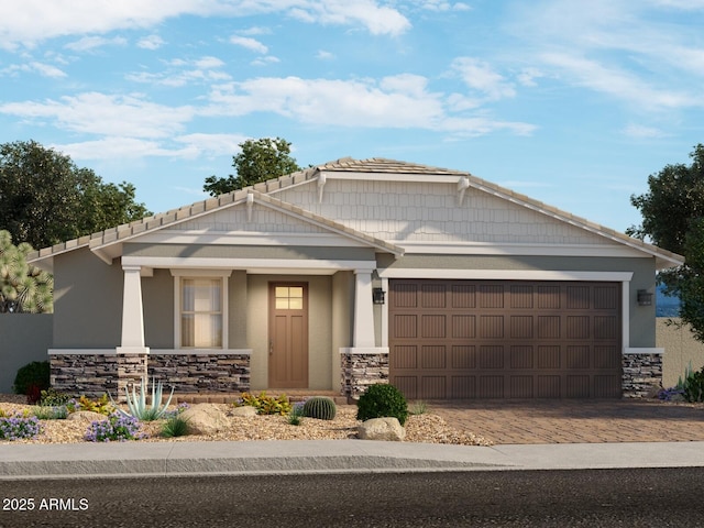 craftsman inspired home with an attached garage, stone siding, a tiled roof, decorative driveway, and stucco siding