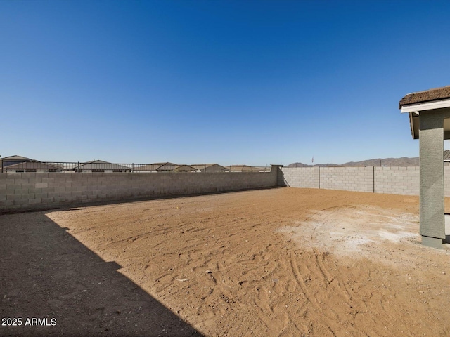 view of yard with a fenced backyard