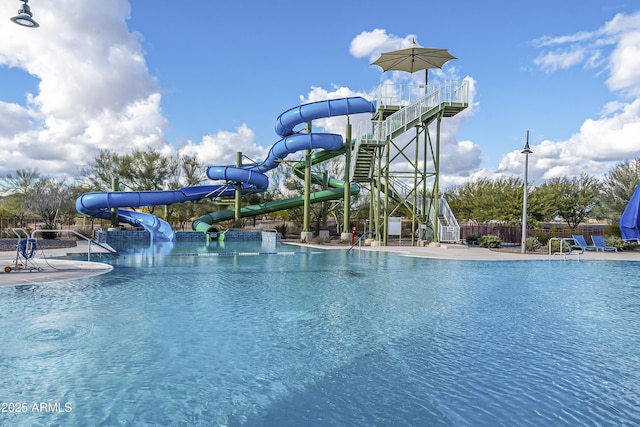 view of pool with a water slide