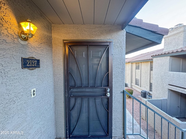 entrance to property featuring central AC