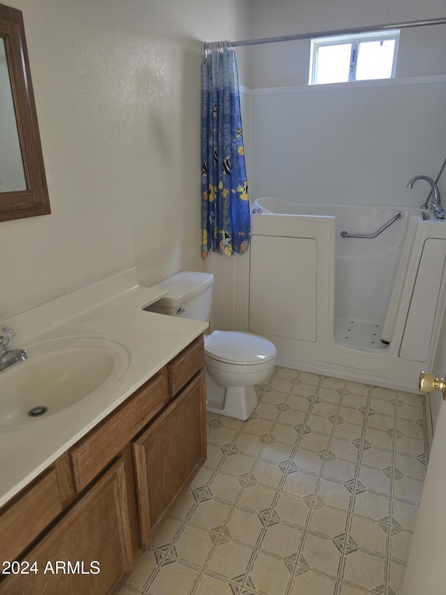 full bathroom with shower / bathtub combination with curtain, vanity, and toilet