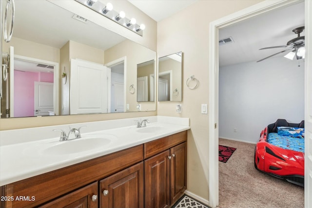 bathroom featuring double vanity, a sink, and visible vents