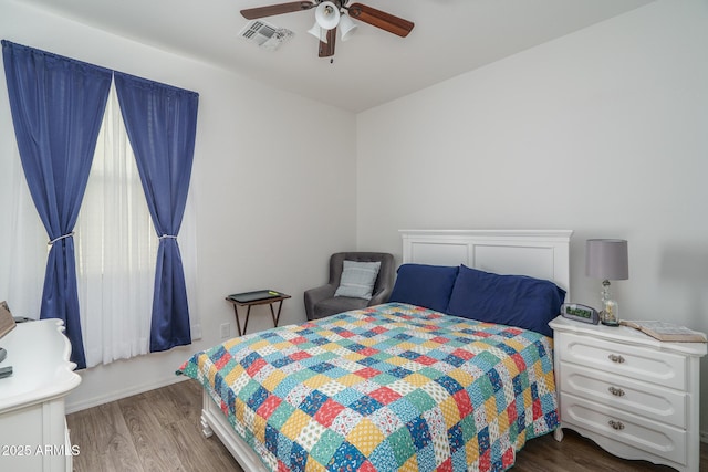 bedroom featuring wood-type flooring and ceiling fan