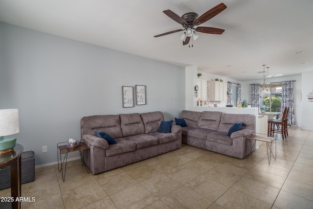 living room featuring ceiling fan and light tile patterned floors