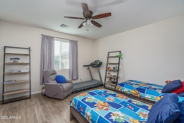 bedroom featuring ceiling fan and wood-type flooring