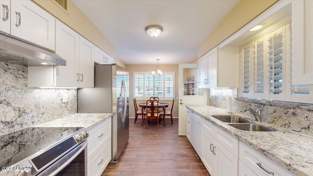 kitchen featuring stainless steel appliances, sink, dark hardwood / wood-style floors, decorative light fixtures, and white cabinets