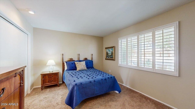 bedroom with light colored carpet