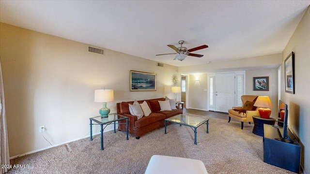 living room with light colored carpet and ceiling fan