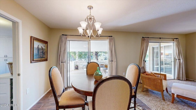 dining room featuring an inviting chandelier and hardwood / wood-style flooring