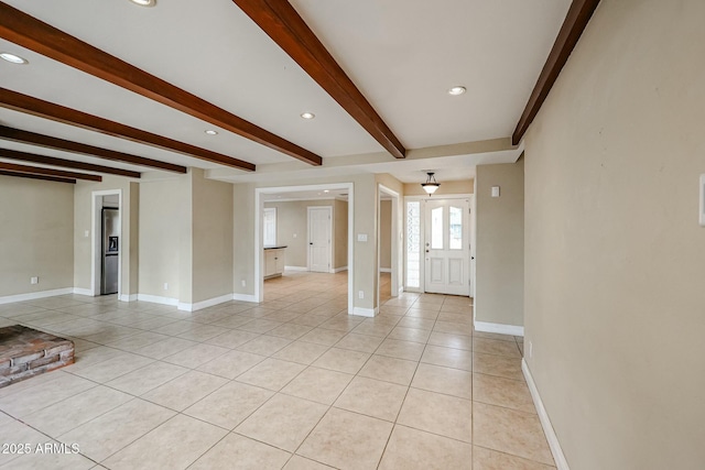 interior space with recessed lighting, beam ceiling, baseboards, and light tile patterned floors