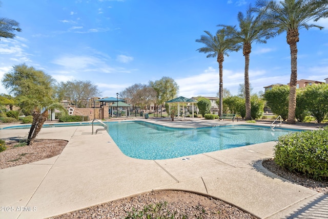 community pool featuring a gazebo and a patio