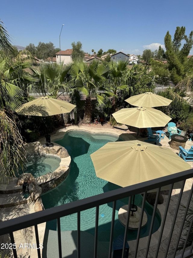 view of pool featuring a pool with connected hot tub