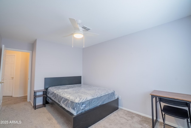 carpeted bedroom featuring visible vents, ceiling fan, and baseboards