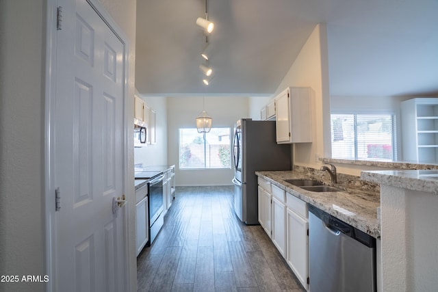 kitchen featuring a sink, white cabinets, dark wood finished floors, and stainless steel appliances