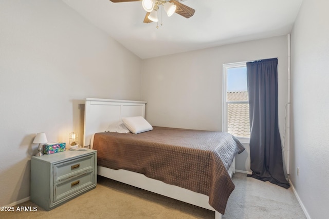bedroom with ceiling fan, light colored carpet, and baseboards