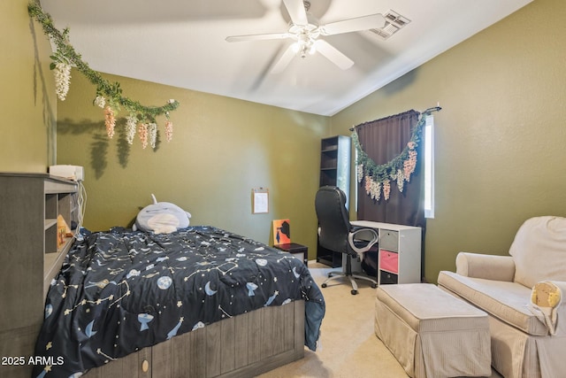 bedroom featuring carpet floors, a ceiling fan, vaulted ceiling, and visible vents