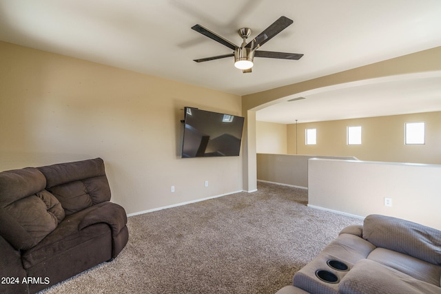 carpeted living room featuring ceiling fan